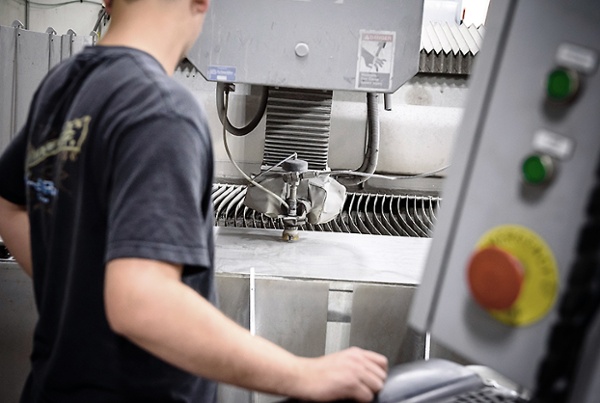 parts technician with waterjet